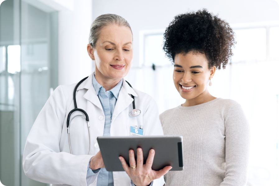 doctor using tablet and showing patient