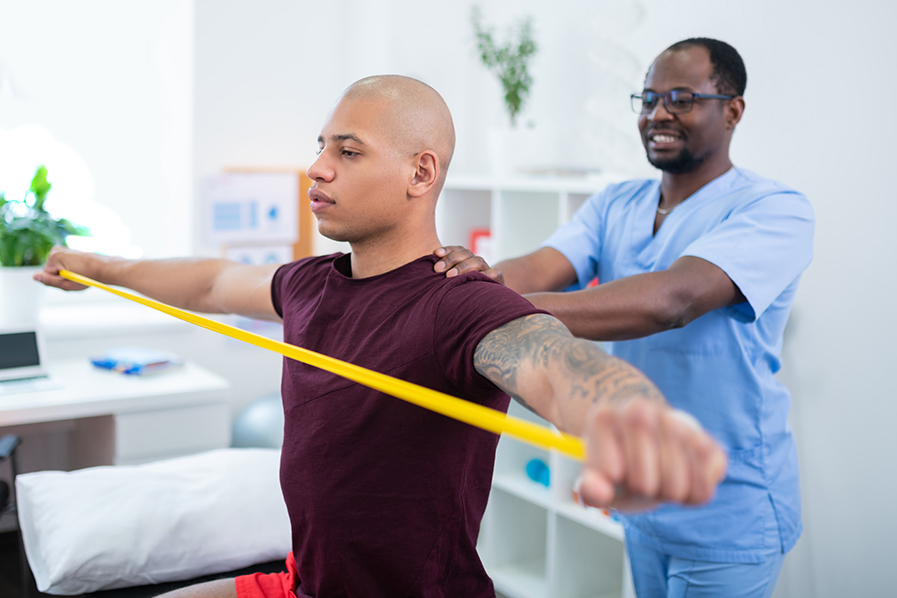 therapist and patient resistance training