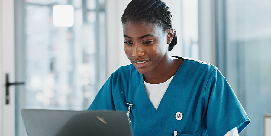 therapist using laptop smiling